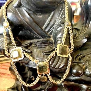 Lavallière necklace with topaz colored faceted stones framed in gold tone